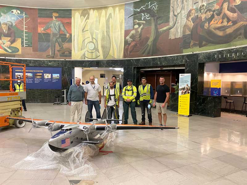 Arrival of the New B314 Yankee Clipper Model. Ed Trippe (Left) & Roger Jarman (2nd from L) stand with the Port Authority Maintenance Crew